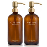 Vine Creations amber glass soap dispenser set with a brushed brass pump on the countertop.