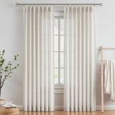 Vision Home pinched-pleated curtains provide a polished living room look.