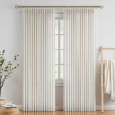 Vision Home pinch-pleated curtains in beige texture add refined style to living spaces.