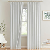 Vision Home white pinch pleated curtain front view highlights the sleek design and blackout potential.