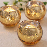 Volens gold votive candle holder with mercury glass finish for warm table glow