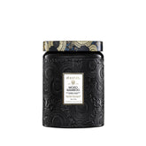 Voluspa Moso Bamboo candle 18 oz in a sleek jar adds woodsy ambiance.