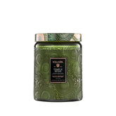 Voluspa Temple Moss candle jar front view, enhancing calm ambiance with earthy fragrance.
