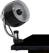 Vornado Pivot3 Clip on a desk delivering compact airflow for focused cooling.