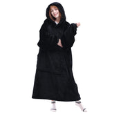 Waitu wearable blanket hoodie front view showing plush material and oversized fit for lounging.