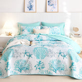 Wake In Cloud coastal quilt with aqua seashell pattern for a serene beach-inspired bedroom