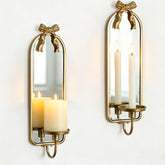 Walasis gold arch bow candle sconce with mirror reflects ambient light