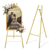 Watihere gold easel stand displaying a wedding sign with stable visibility.