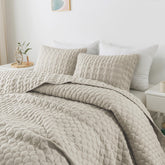 WDCOZY light beige oversized Cal King quilt folded for easy styling.