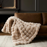 WDCOZY luxury bubble throw blanket in beige for warm, inviting living room ambiance.