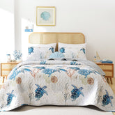 Weigelia coastal quilt with sea turtle print adds seaside charm.