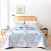 Weigelia Coastal Quilts Queen blue quilt flatlay shows breezy seaside style.