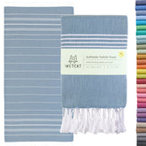 Wetcat Turkish towel in denim blueβoversized and ultra-soft for beach days.
