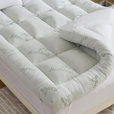 WhatsBedding 5-inch memory foam topper with bamboo cover provides soft support for full-size beds.