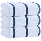 White Classic oversized navy striped cotton towel draped for pool lounging