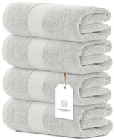 White Classic luxury bath towels set, four-piece wide-shot, showcasing plush hotel-grade softness.