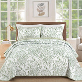 WONGS BEDDING sage green quilt on a king bed adds fresh, versatile style.