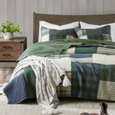 Woolrich Mill Creek quilt close-up shows patchwork stitching and soft cotton texture