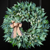 WREATHOME 26-inch green wreath for the front door adds year-round curb appeal.