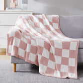 WRENSONGE checkered throw blanket pink close-up highlights plush texture and warm feel.