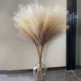 Wttisel 38-inch faux pampas grass in a tall vase adds airy texture.