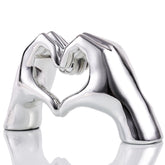 WUBIANJIE Silver Heart Hands Sculpture close-up shows detailed resin carving and modern elegance