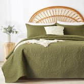 WURUIBO olive green quilt set on bed, cozy warmth and easy care.