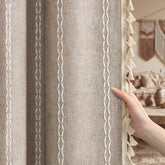 XOGUIBO brown boho blackout curtains in 84-inch length provide living room privacy.