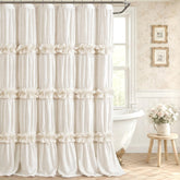 XOGUIBO ruffle shower curtain with bow detail in cream enhances vintage charm.