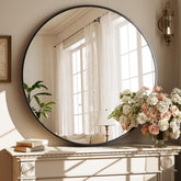 XRAMFY round mirror with matte black frame enhances modern entryway decor