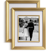 Yaetm 11x14 gold frame with decorative inner frame highlights portraits on a wall.