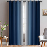 Yakamok blue-to-grey ombre curtains provide privacy and soft light control.