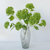 YalzoneMet Snowball Viburnum Hydrangea stem arrangement adds elegant vertical interest.