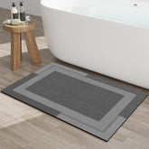 YDKGL non-slip bath mat with rubber backing provides secure grip on wet floors.
