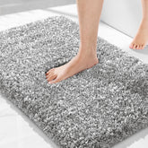 Yimobra bathroom rug non-slip 32x20 keeps feet secure on wet floors.