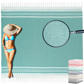Yongoes oversized Turkish beach towel blanket on sunlit sand, ideal for family outings.