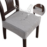 YUEANG leaf-pattern seat cover protects dining chairs from spills.