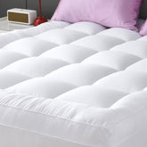 YUGYVOB mattress pad extra thick with plush fill for enhanced comfort during sleep.