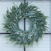 YXZZWL 26-inch eucalyptus wreath on a front door boosts curb appeal.