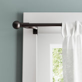 Zenna Home adjustable curtain rod extended to 48–84 inches for flexible window coverage.