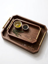Zephine Home hexagonal tray in dark brown with gold handles for elegant serving.