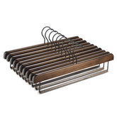 ZOBER wooden pants hanger with anti-slip brass bar for secure grip.