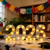 ZUOKEMY LED marquee 2026 sign with bold digits and warm glow for festive photos