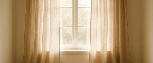 Floor-length curtain panels on a bright window