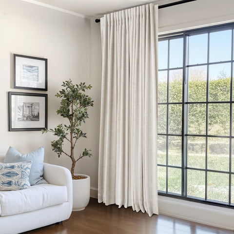 Care label on 100% Blackout Shield curtains with machine wash guidance.