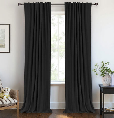 100% Blackout Shield linen curtains in a dark bedroom offer total light control.