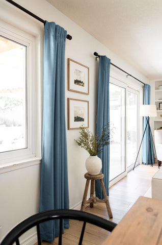 Two panel set covers wide windows in a living room for broad coverage
