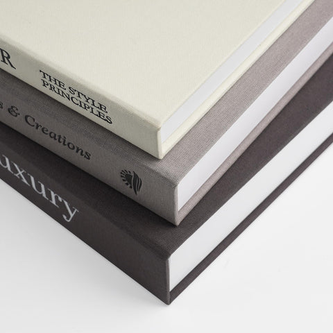 1DOT2 three different sizes of decorative books add visual interest