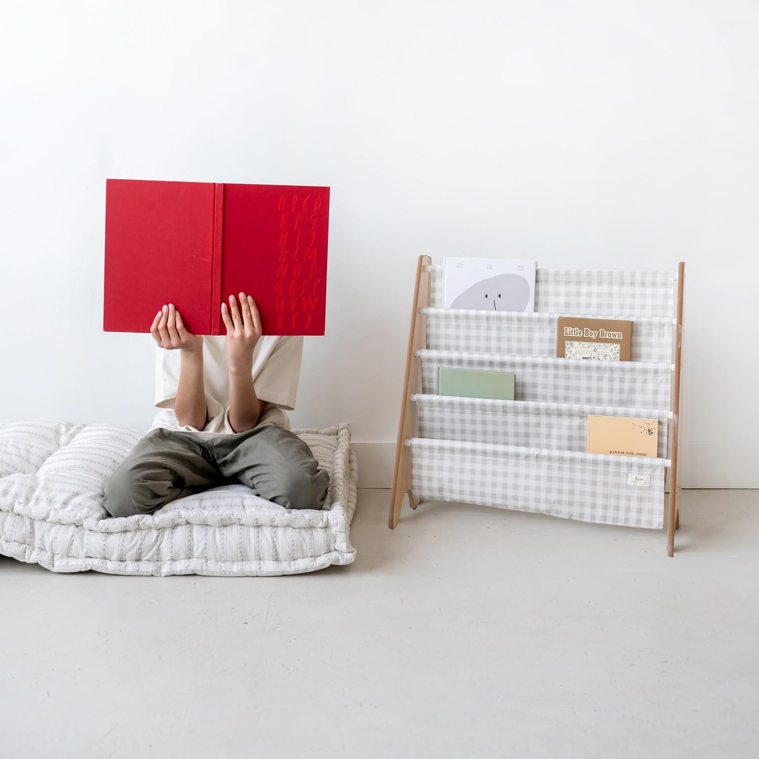 3 Sprouts toddler-height bookshelf enables kids to grab and replace books independently.