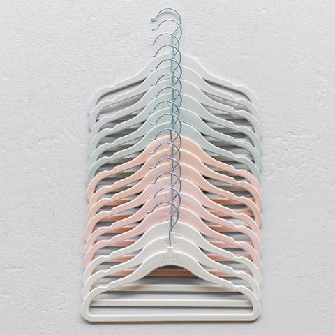 3 Sprouts Velvet Baby Hangers nursery decor pink tones complement a calm space.